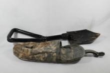 Military style folding shovel in digital camo belt bag. Used.
