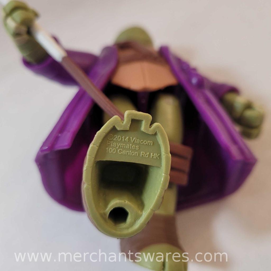 Four Donatello Teenage Mutant Ninja Turtles Figures including 2011 Merlin Wizard Donatello, 1990