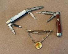 pocket knives and tie clip with fishhook