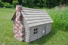 Homemade log house 68"x43"x55" tall to top of chimney, no floor, has door on each long side, has win
