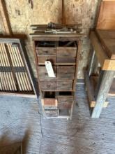 Old wooden cabinet with pull out drawers, full of miscellaneous....