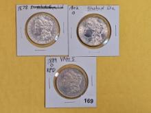 Three Morgan silver dollars with Varieties