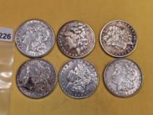 Six Morgan silver Dollars