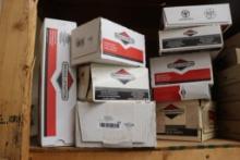 QUANTITY OF BRIGGS AND STRATTON PARTS INCLUDING STARTERS, INTAKES, MUFFLERS, ETC.