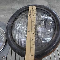 Lot of Harley Davidson motorcycle headlights some vintage