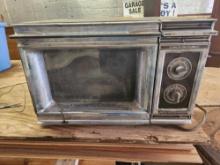 antique microwave turns on