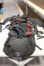 Red and black large nylon foam padded backpack. Used.