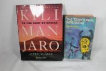 Two hard cover books. The Territorial Imperative and Kilimanjaro, The root of Africa.