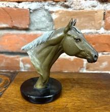 Bronze horsehead statuette