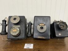 Three Stromberg Carlson metal wall telephones with receivers