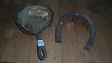 cast iron items, small skillet and a horse shoe