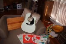 Johnson Acoustic Guitar and Vintage Sheet Music
