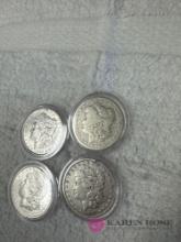 lot of four vintage silver dollars