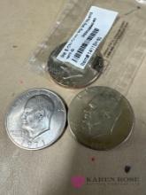 three Ike silver dollars