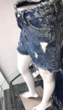 Half mannequin with shorts