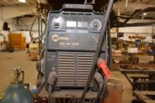 Miller XMT 304 Welder w/Miller 22A Feeder; Item in use until plant closure.