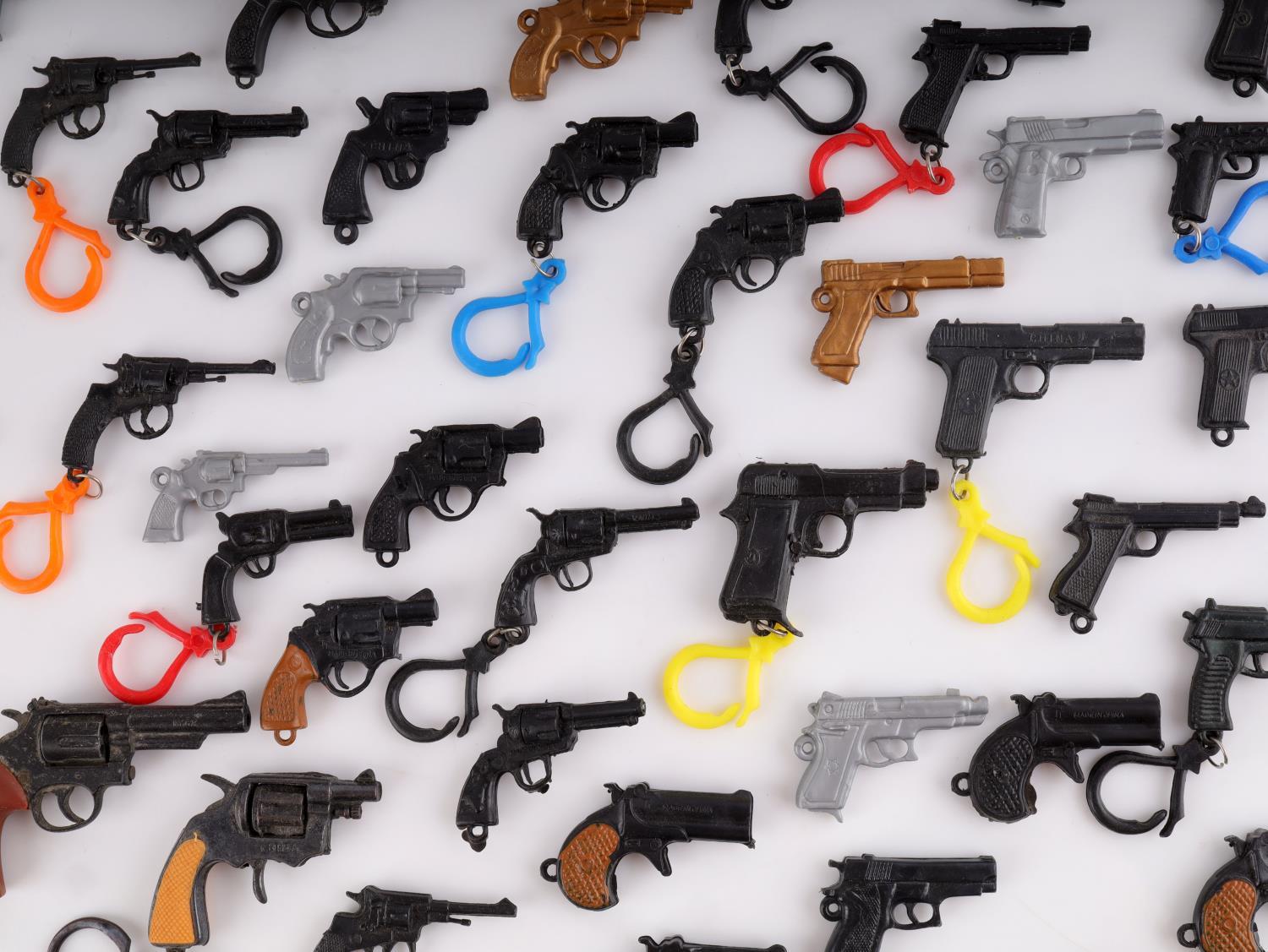 LARGE COLLECTION OF MINIATURE TOY GUN LOT