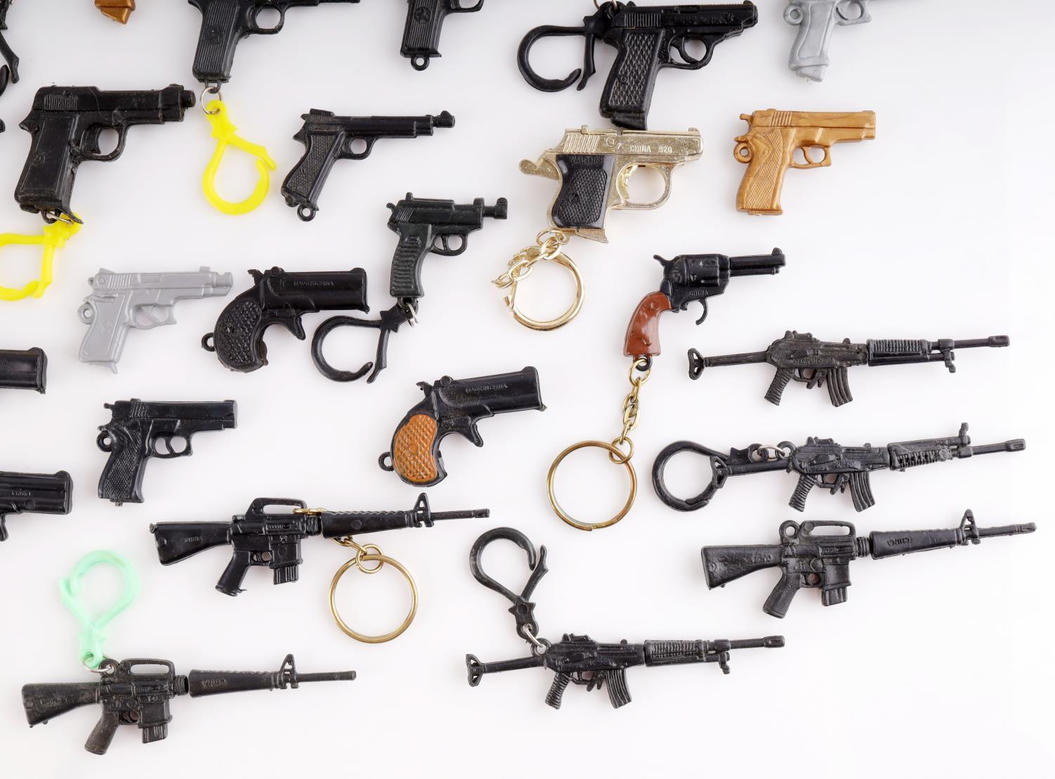 LARGE COLLECTION OF MINIATURE TOY GUN LOT