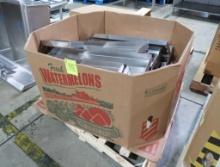crate of stainless pans