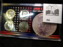 Four-piece John F. Kennedy Half Dollar Collection. 1964 P 90% Silver; 1966 P 40% Silver; 1776-1976 P