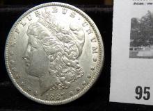 1887 O Morgan Silver Dollar. EF.