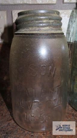 Three vintage canning jars with zinc lids