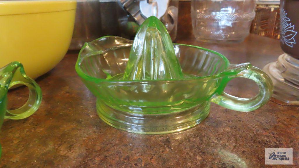 Two green depression...glass...juicers