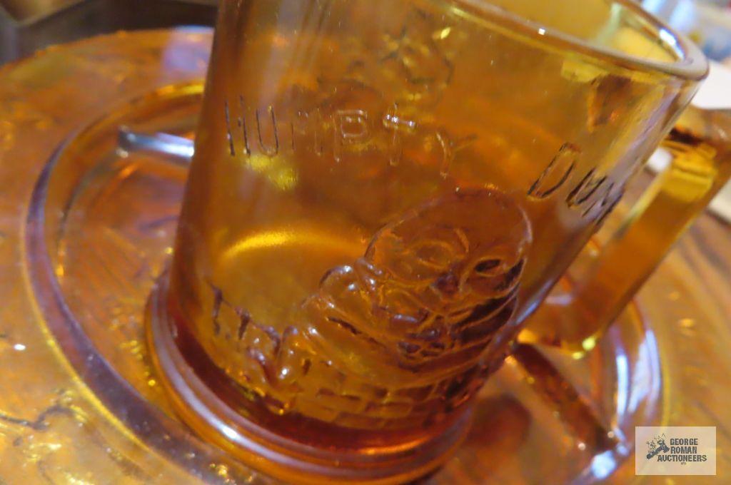 Child's amber glass plate and Humpty Dumpty mug