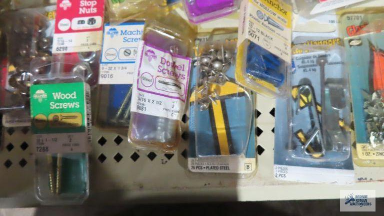 Assorted hardware including nails, screws, hangers