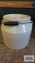 Cream colored handled crock with lid