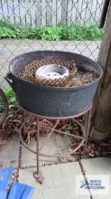 Cast iron cauldron with metal stand