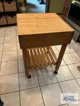 Butcher block style kitchen island....33 inches high, 2ft by 2 ft.