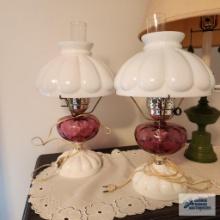Two vintage milk glass and pink glass lamps