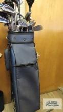 Golf bag with assorted clubs.