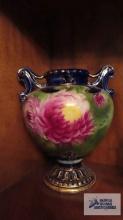 Hand painted double handled vase with screwed on base