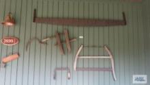 Lot of assorted antique tools on wall