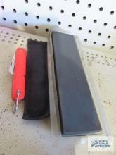 Camping knife with holder and sharpening stone