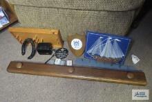 Wooden shelf, Kodak instamatic 304 camera case, wall hangings, string art ship wall hanging, etc