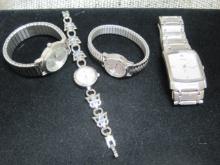 Four Silver Tone Watches