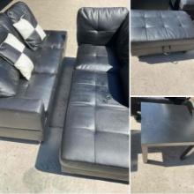 Black, two pieces sectional sofa, ottoman with storage, table and two pillows