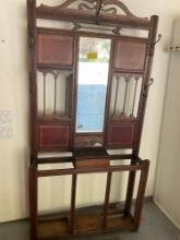 Antique wood hall cabinet with mirror, coat hooks, umbrella area and cubby for gloves
