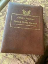 Golden Replica of Unites States stamps, proof replicas on a gleaming surface of 22kt gold album &