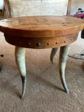 Wood top, horn legs side table. 23" x 25"