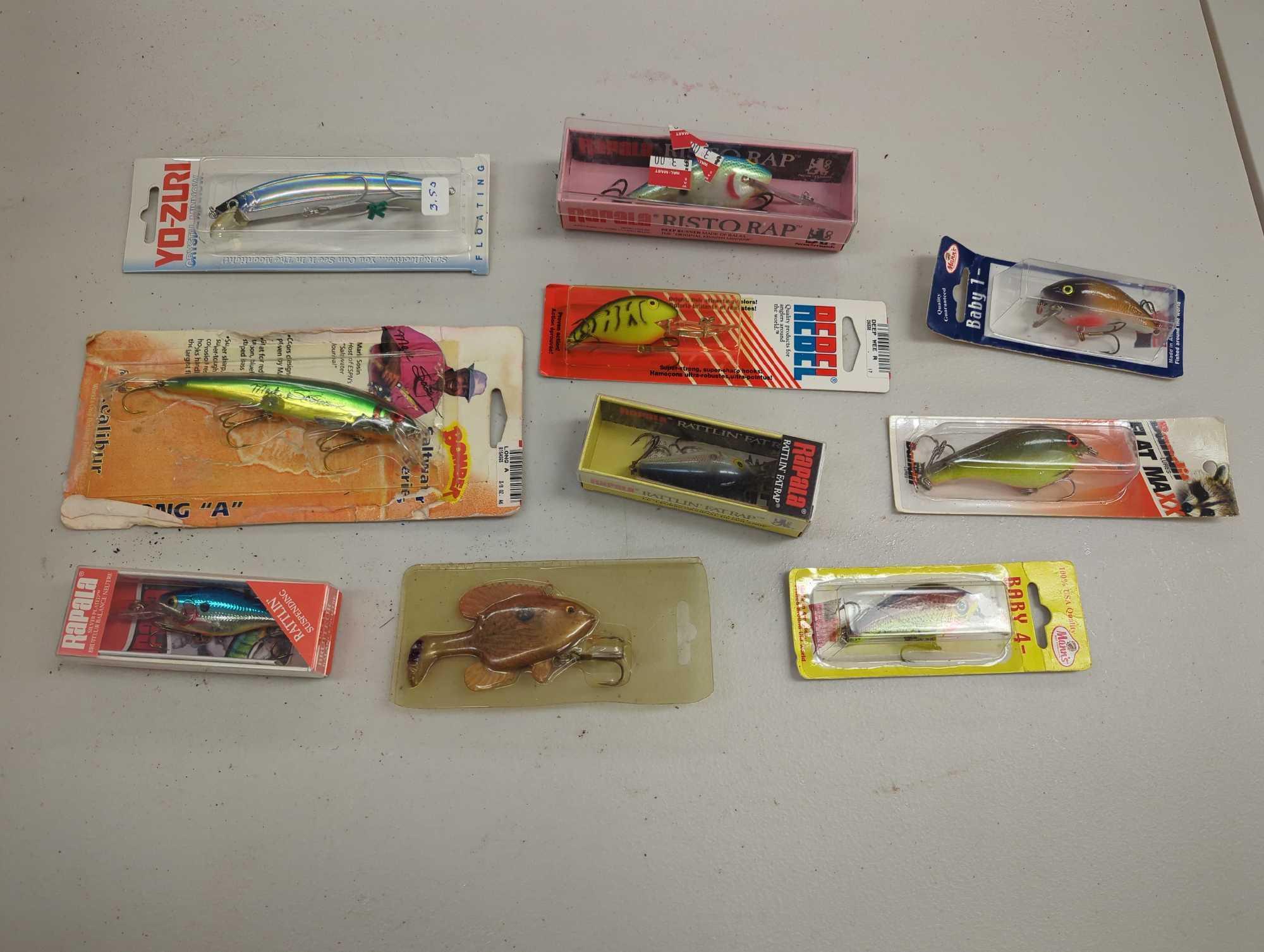 Clear organizer tote and contents including various fishing lures and other fishing accessories.