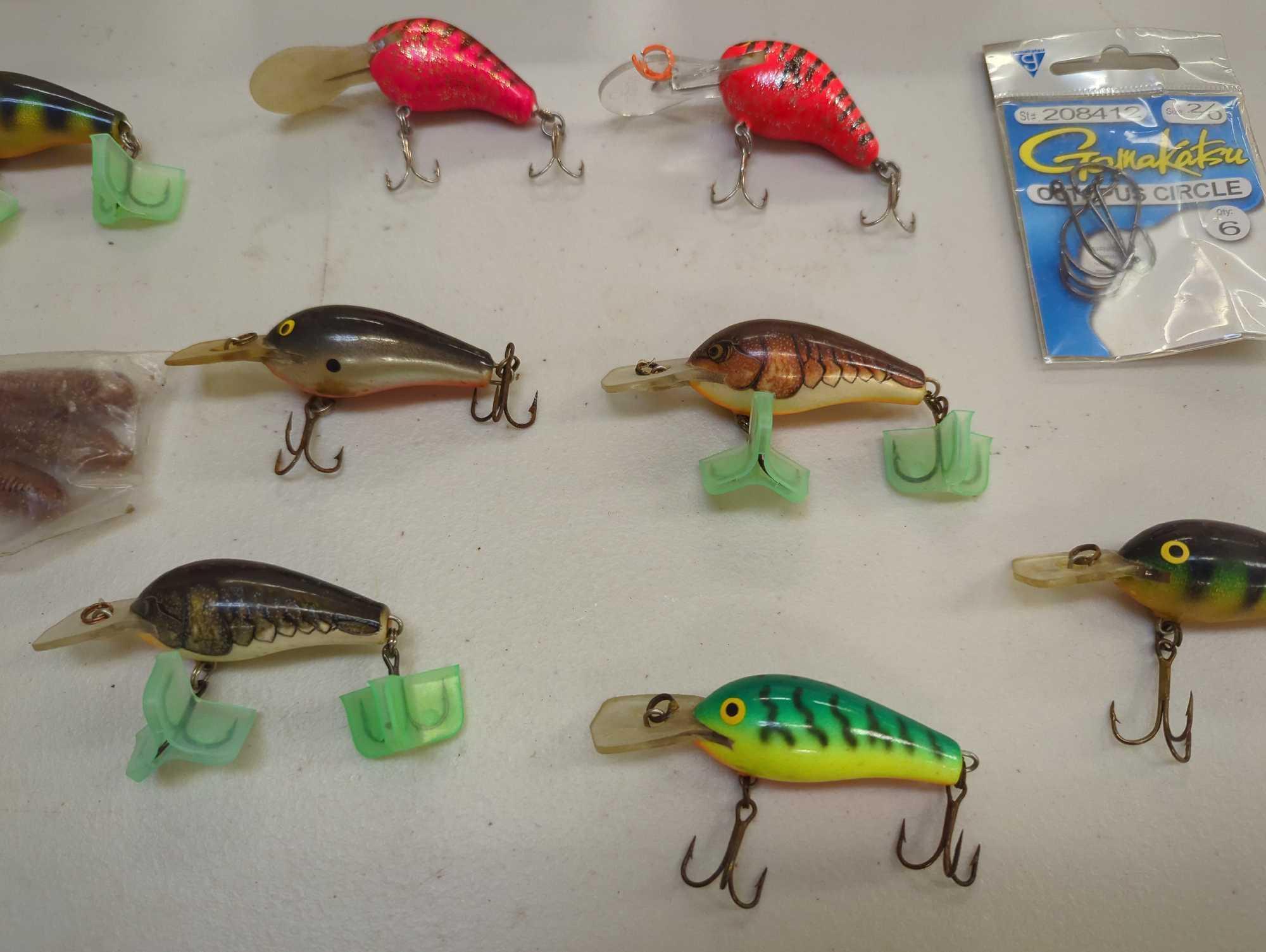 Tackle Box and contents including various fishing lures of similar style. Comes as is shown in