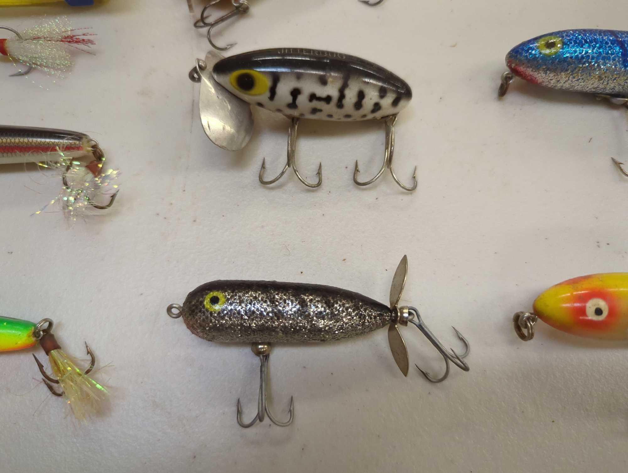 Tackle Box and contents including various fishing lures of similar style. Comes as is shown in