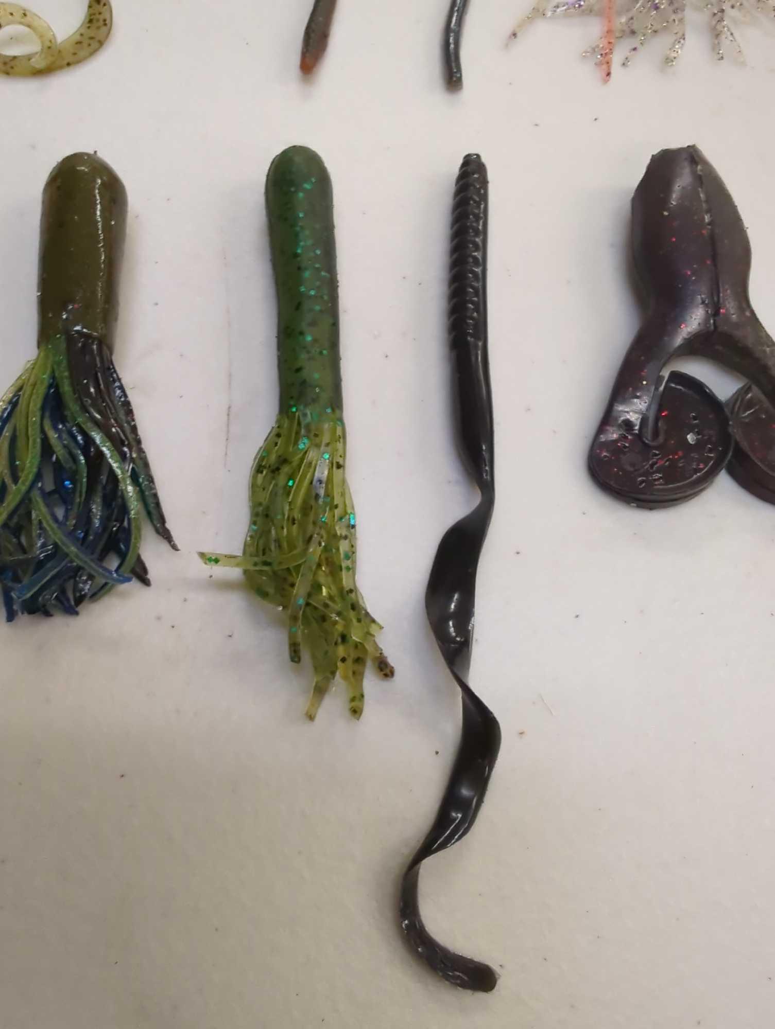 Tackle Box and contents including various fishing worms of similar style. Comes as is shown in