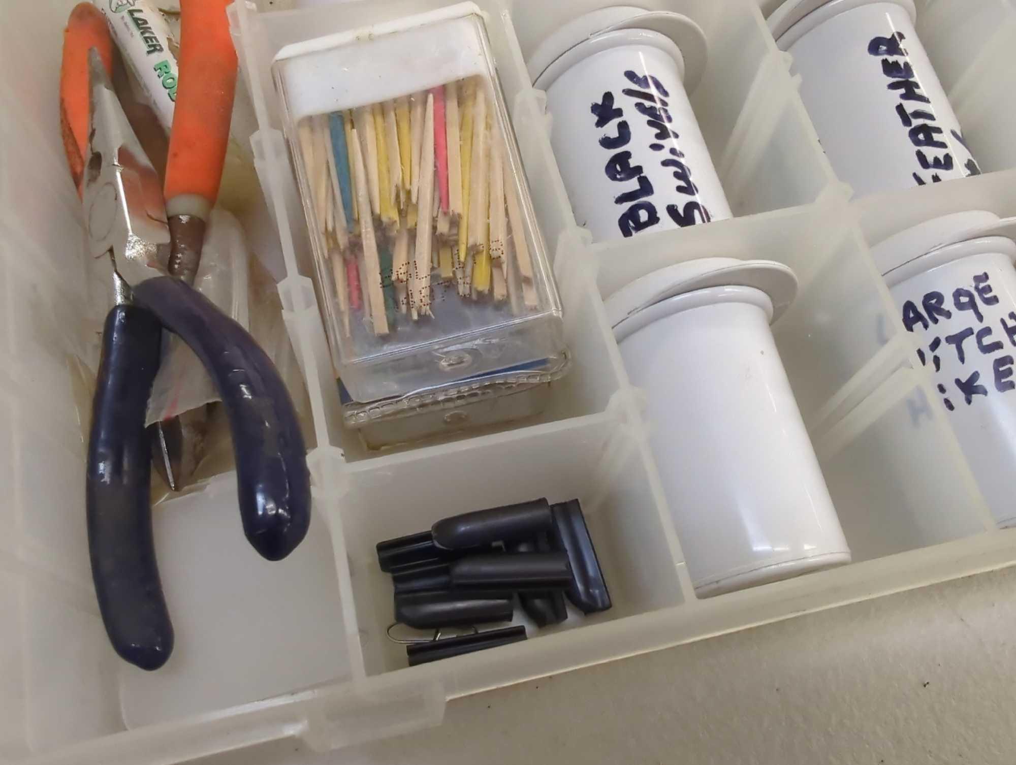 Tackle Box and contents includes fishing hooks, accessories and tools. Comes as is shown in photos.