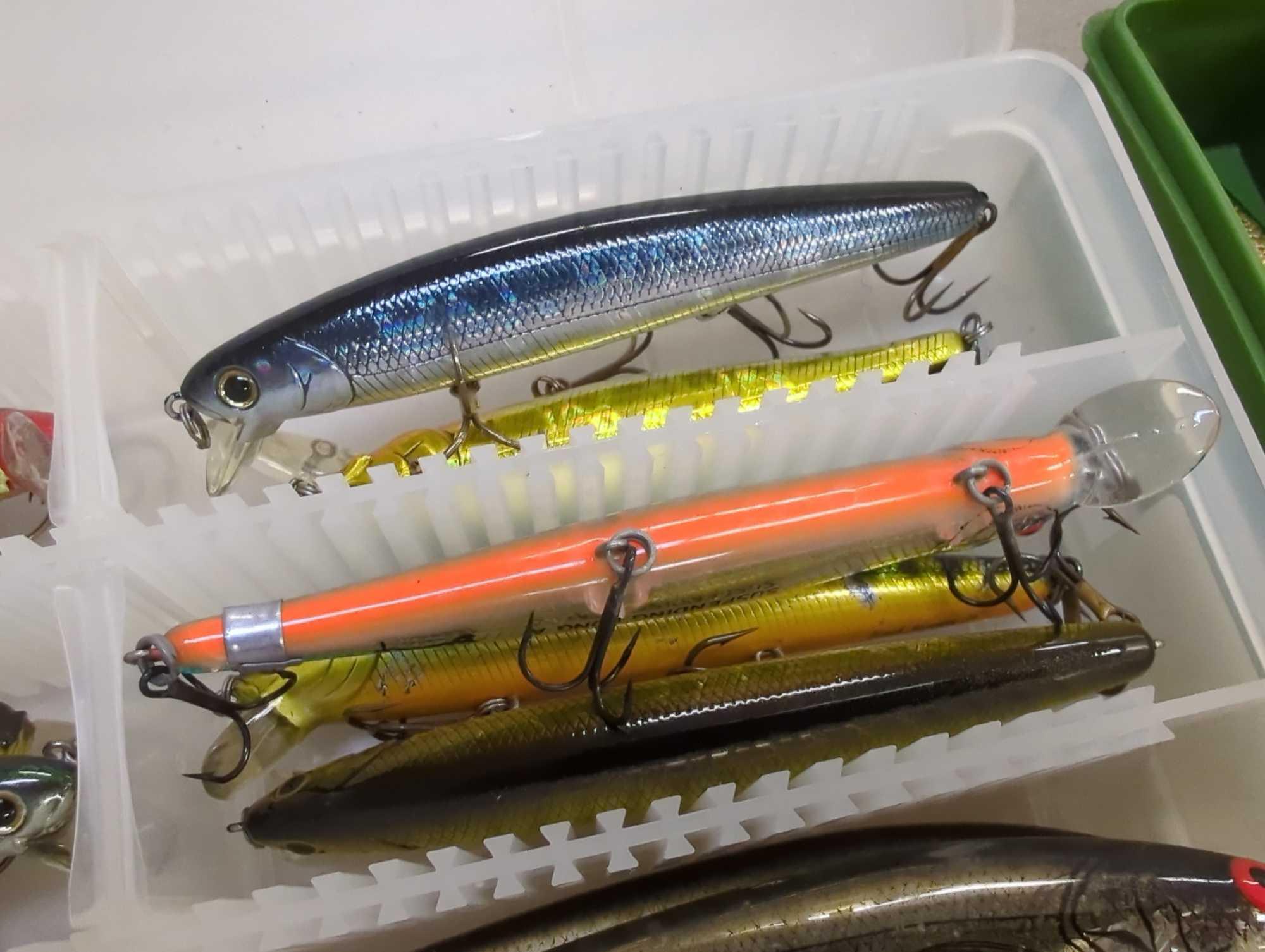 2 small tackle boxes containing fishing lures of similar style. Comes as is shown in photos. Appears