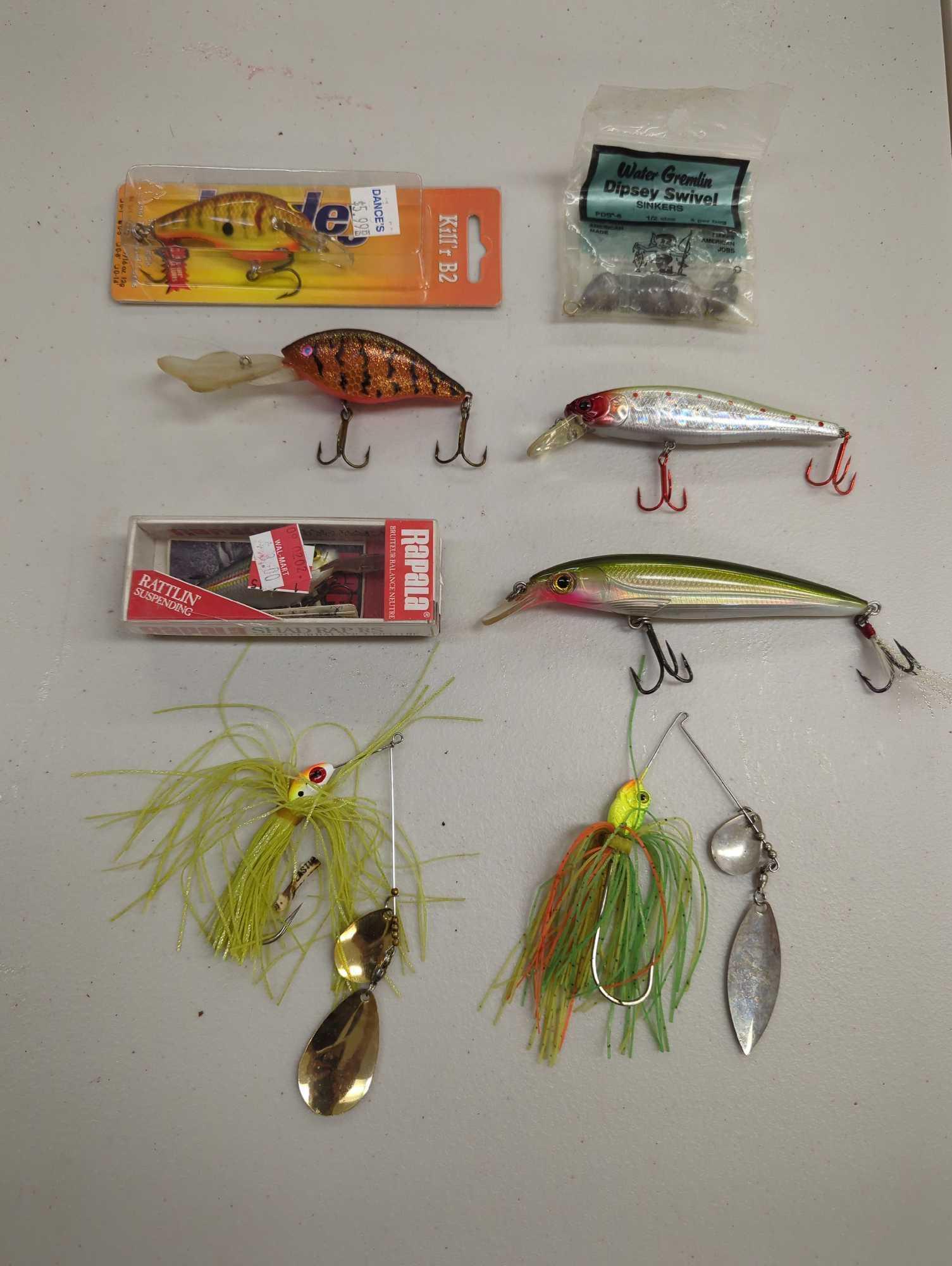 Tackle Box and contents including various fishing lures and other fishing accessories. Comes as is